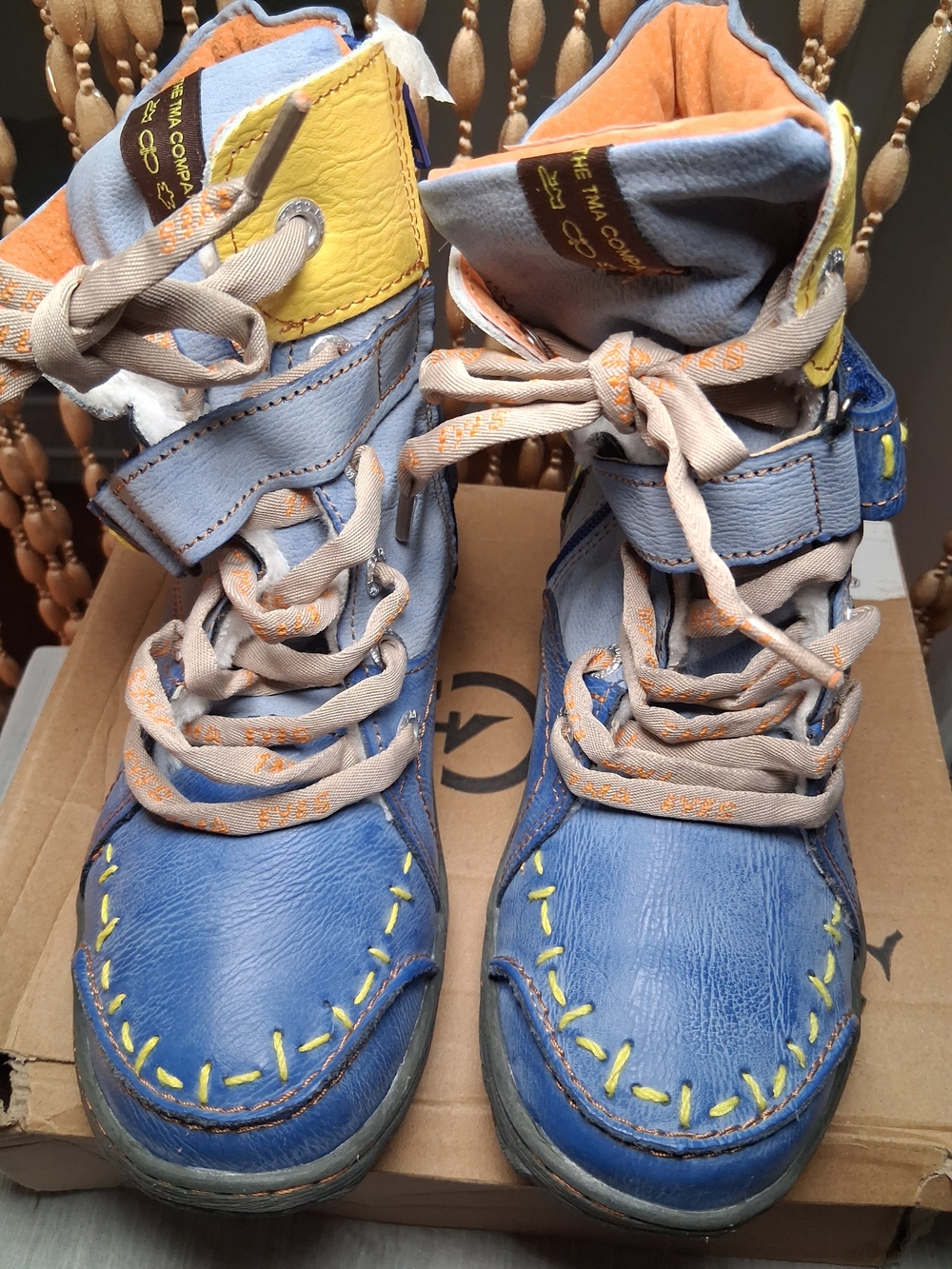 Blue High-Top Sneakers with Yellow Stitching - TMZ